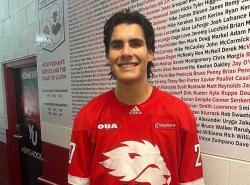 Lucas Eagle is pictured wearing a red jersey with a white lion logo on it.