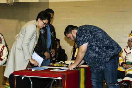 Councillor Carlin Black Rabbit signs official documents