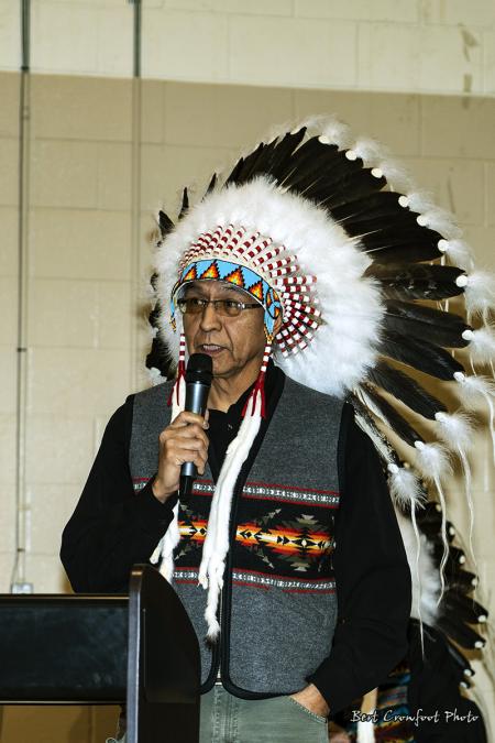 Councillor Leon Crane Bear addresses the gathering